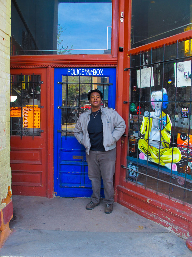 Richard by a police box door