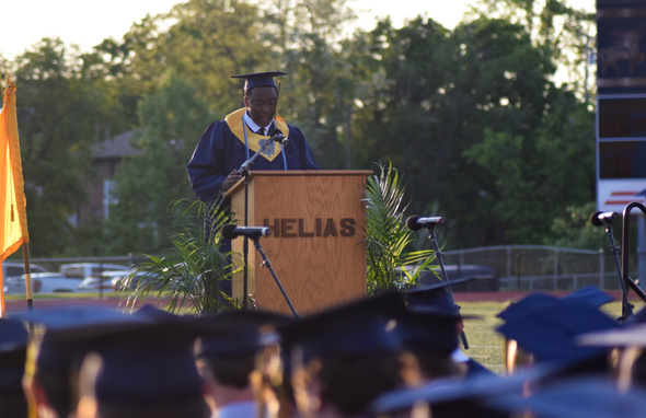 Richard giving his valedictorian speech at a podium