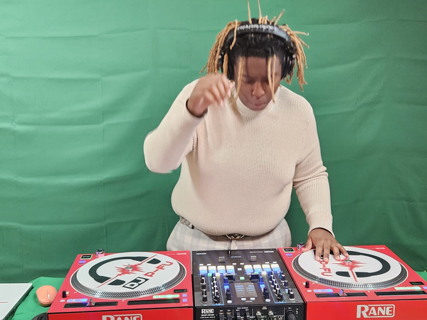 Richard DJing on a green screen set