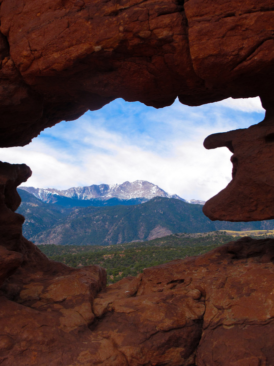 Mountain view through a rock arch